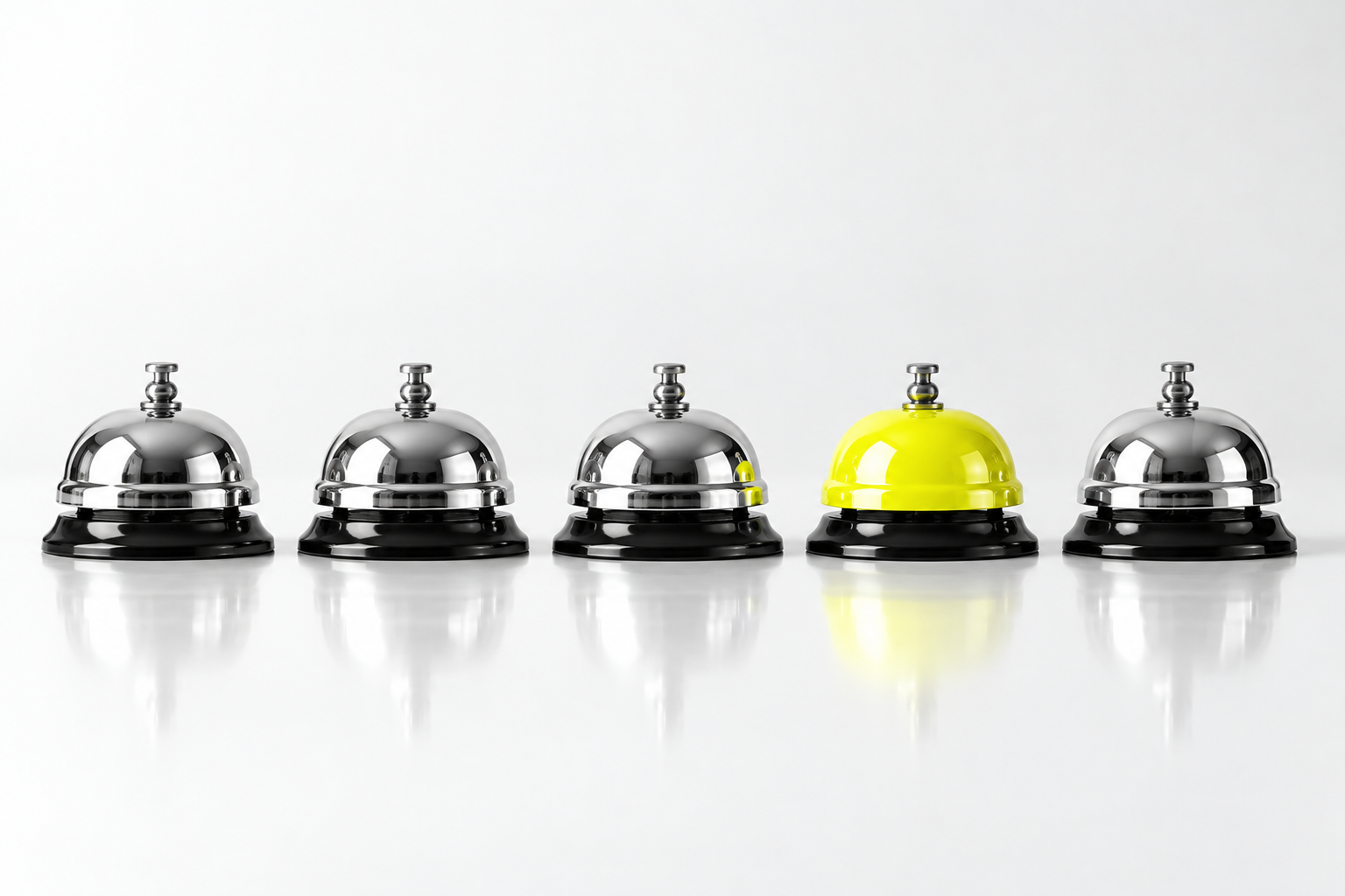 Five reception bells, with one yellow bell standing out among chrome bells.
